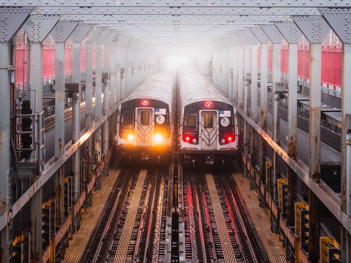 Two 7 trains idling nose to nose on the elevated tracks in heavy fog, Queens, New York