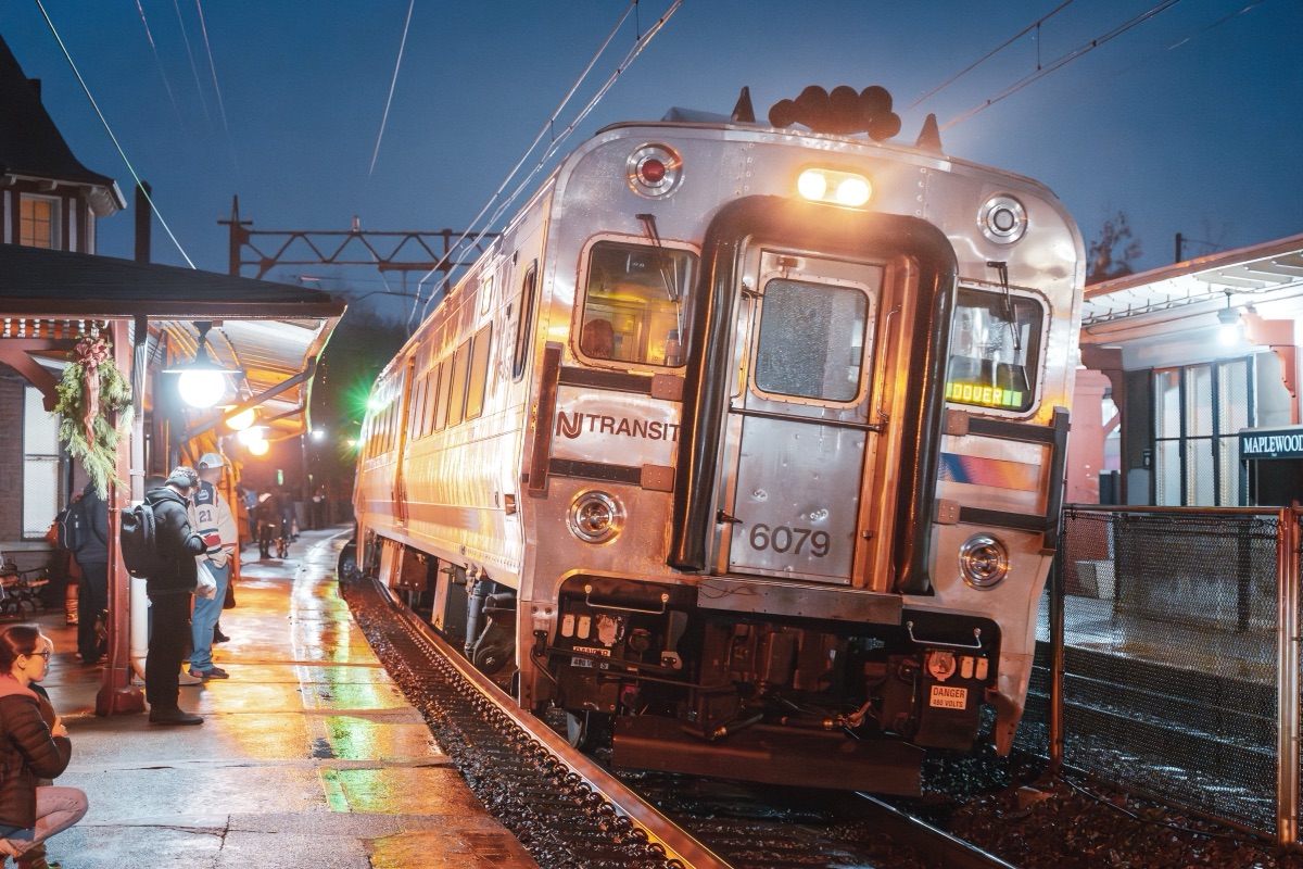 NJ Transit train 6079 pulling into Maplewood station on a wet winter evening