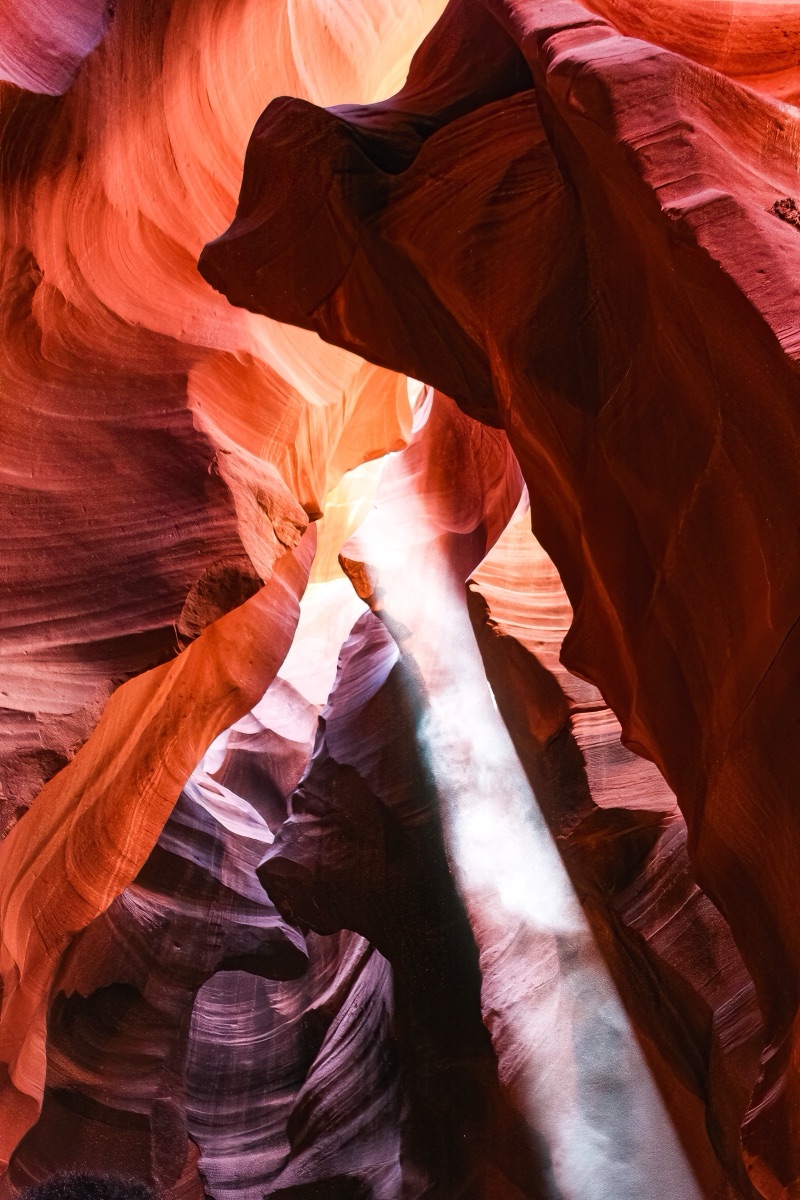 A shaft of light falling through the carved sandstone walls of Antelope Canyon, Arizona