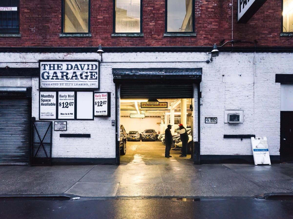 Attendants outside The David Garage on a wet morning in Tribeca, New York